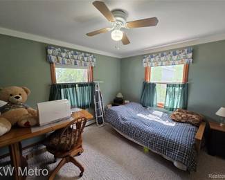 Large teddy bear (probably comes alive at night), desk and chair and sewing machine, ironing board, window toppers and cafe curtains, daybed, and lamps, and everything else too