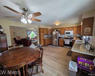 Everything that you see in the kitchen is also for sale, the cabinets, the flooring, the table and chairs, all the appliances, the snacks, the garbage can the pictures, and that gnome in the upper left