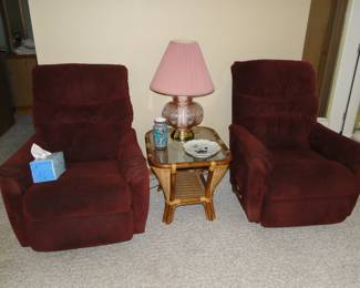 Dual pair of recliners, and there is more. That rattan and glass topped table is part of a pair