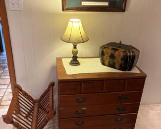 magazine rack, chest of drawers, lamp, decor