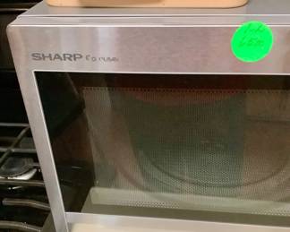 Sharp microwave.  Has round glass tray inside that rotates.  In excellent condition.