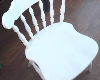 One of the white chairs for breakfast table.