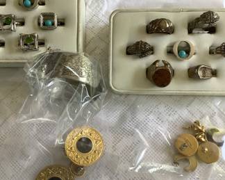 More costume jewelry with pewter bracelet in bag.