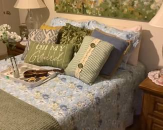 Queen size bed with beautiful coverlet, 2 Waterford lamps on 2 matching oak end tables.