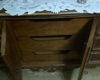 The doors behind the dresser front.