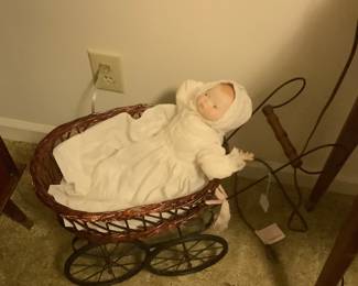 Old wicker carriage for the baby dolls.