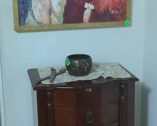 Oil painting with tall mahogany jewelry case with lots of drawers and side doors.