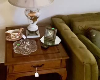 The two lamps in living room are 2 Vintage lamps with gold leaves on front with marble base.