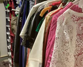 More clothing with shoes, shoe racks.