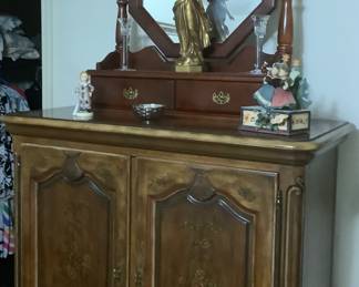 The chest in the bedroom suite.  Sitting on top is a bureau mirror with drawers.