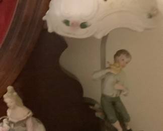 2 beautiful collectible porcelain lamps, one with boy and other one with girl.  Has flowers on shade and at bottom.  Must see to appreciate.