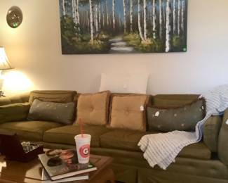 A beautiful MC green couch with silk like fabric.  In excellent condition.  Thst color can go with any color.