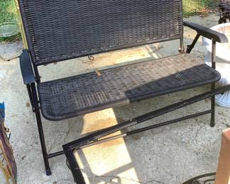 Metal and wicker folding bench.