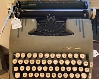 Very old Smith Corona metal typewriter.