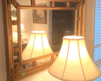A beautiful gold 60’s mirror.