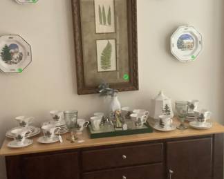 The black buffet/cabinet in breakfast room set with some of the Christmas China.  Has several drawers.