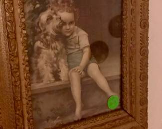 Antique framed boy with his dog.