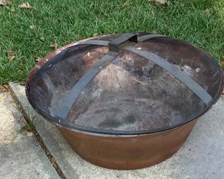 The copper fire pit with screen.