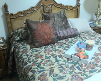 The bed spread with pillows on bed.