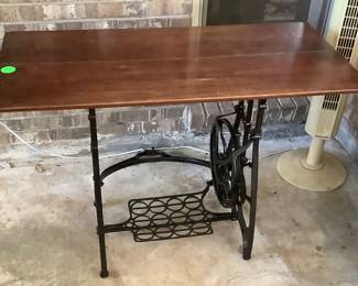 Sewing machine base with wood top.