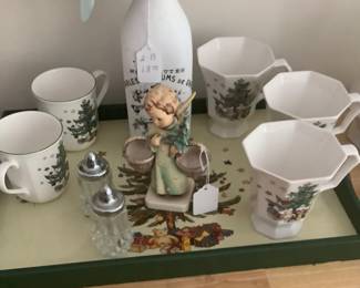 Some of the Christmas China sitting on Christmas tray with a sweet Hummel Angel.