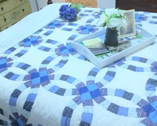 Lovely quilt on bed.
