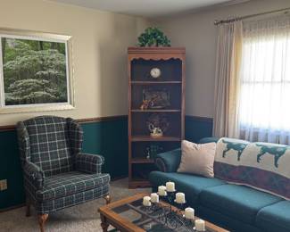 Hunter green couch. Plaid wingback chair