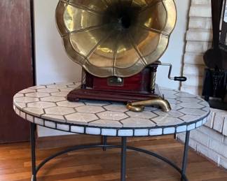 Antique Victrola on contemporary tiled table