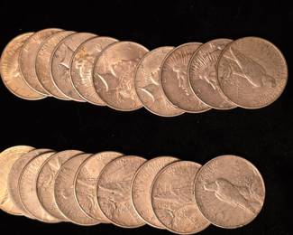 A few of the Peace Dollars in various years. 