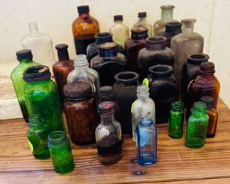 Lots of old bottles and snuff jars