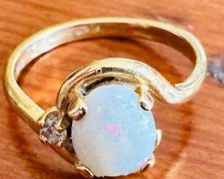 Opal rain with diamond chip set in 14 karat gold