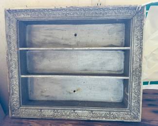 Vintage frame that has been made into a shelf unit