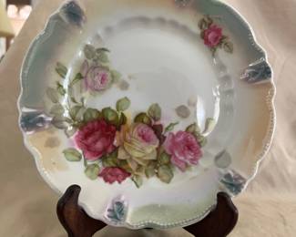 Vintage hand-painted porcelain plate features a beautiful four rose design with delicate beaded edges and yellow and green edge shading.  8"wide.