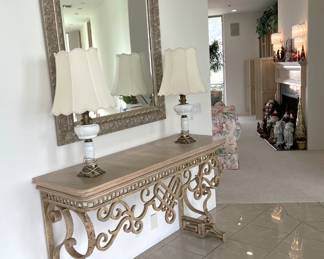 Along the hallway, don't ignore this hallway table, matching lamps, and hanging mirror.