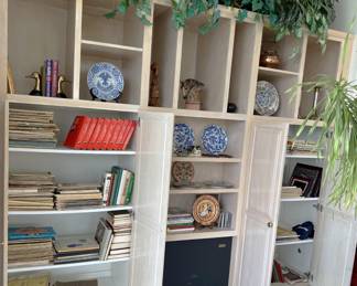 If this house has anything, it is bookshelves. A few decorative plates, a set of Grove's Dictionary of Music and Musicians, and a fair collection of sheet music?