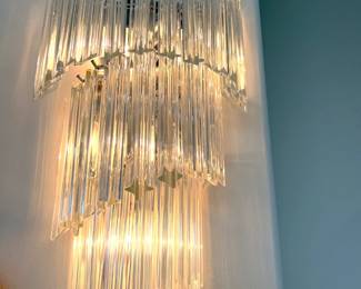In this photo, the crystals skew down to the left. But this is the other matching sconce.
