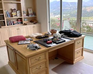 But there is also this desk, which appears to be a dual-writing desk. You can watch the 1980's classic movie Deathtrap to see a similar desk. Then again, it could be just a very deep desk and not for two people.