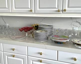 More glassware and plates are shown here.