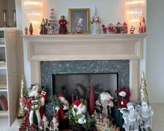 And here we have more holiday-related dolls and decorations. Note the matching wall sconces are shown here above the fireplace.