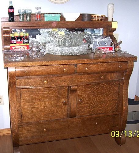 Antique buffet w/ elegant punch bowl set, vintage Coca Cola items, glassware, etc...