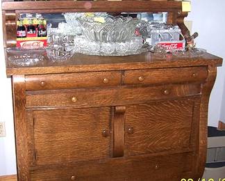 Antique buffet w/ elegant punch bowl set, vintage Coca Cola items, glassware, etc...