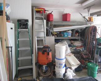 Ladders, shop vac, gas cans, wood