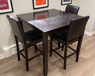$60 - pub height table with 4 chairs (one not pictured), well loved but still functional. Chairs need some love as the legs have been split a little due to people leaning back on them.