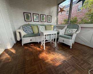 $50 - Vintage wicker patio set - sofa, chair, table. Pillows and wall art included