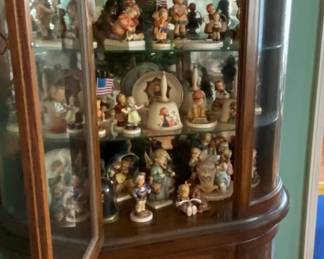 Extensive Hummel collection.  Priced separately.  Curio without contents will be sold as well.
