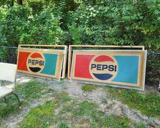 Large Pepsi signs with wooden frames for display