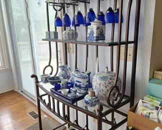 Wine rack with Blue and White Asian Tea Pots , Decanters and Jars. Cobalt Blue Wine Glasses