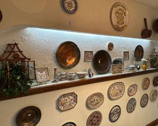 Wall of Copper plates and hand painted terracotta plates