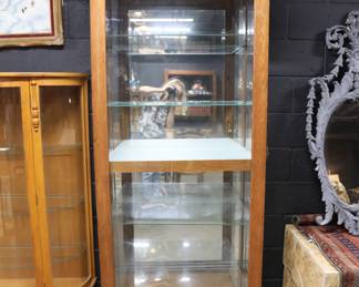 Sliding front door with key /lock lighted curio cabinet by Pulaski Furniture