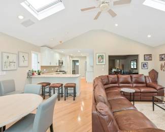 In view in Great Room;  3 kitchen island stools, kitchen table ( Kesler) 6 wonderful blue/grey leather dining chairs, Natuzzi sectional for a fraction of the original price. 